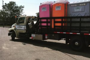 Plummer's truck with porta potties on the back