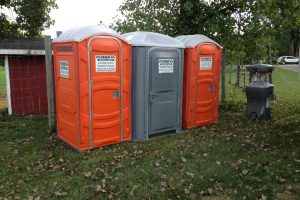 portable toilets at an orchard during harvest season